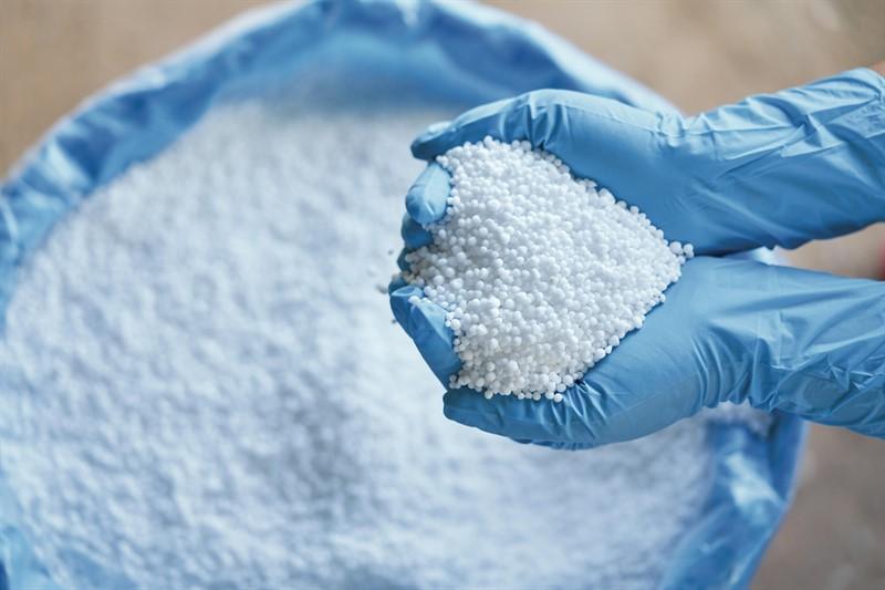 Granular urea held above a bulk bag